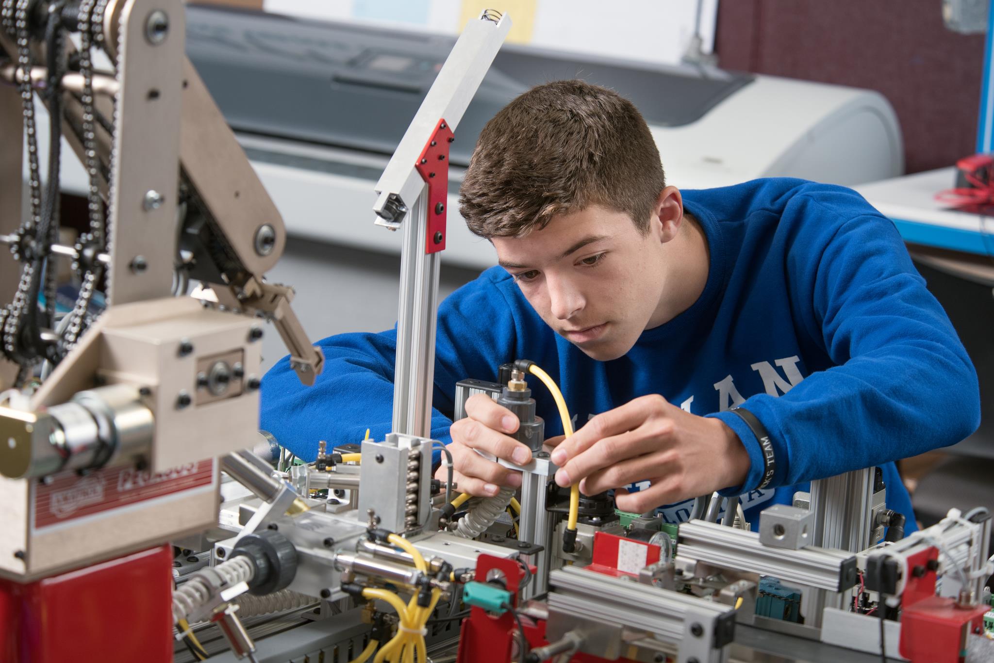 Male Engineering student works on a circuit in the engineering class