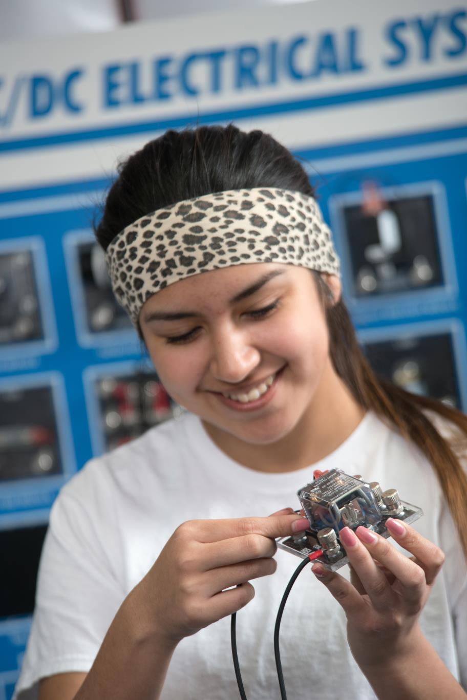 Female Engineering student working on a circuit